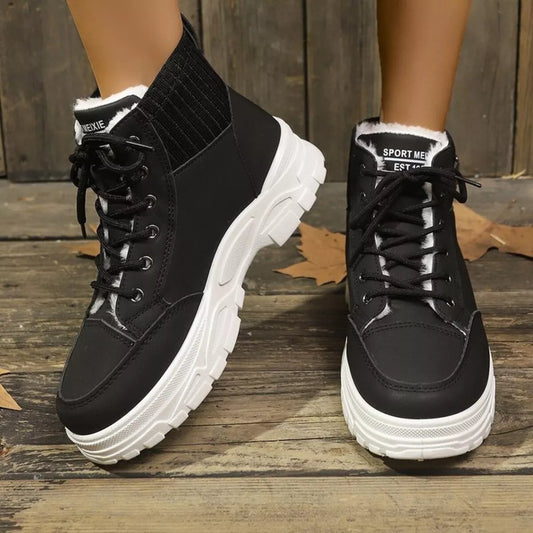 Close-up of thick 11mm plush faux fur lining inside warm winter lace up boots for women