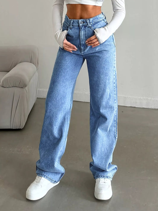 womens baggy jeans wide-leg silhouette side view in blue denim for relaxed, polished day-to-night wear