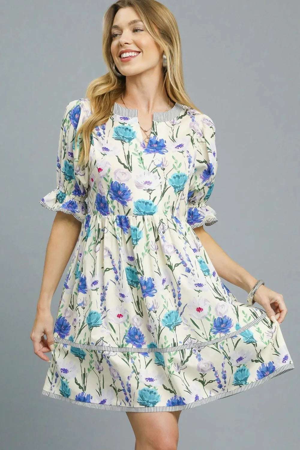 Close-up of puff sleeve on Umgee BabyDoll Floral Striped Hem Mini Dress highlighting feminine elastic cuffs