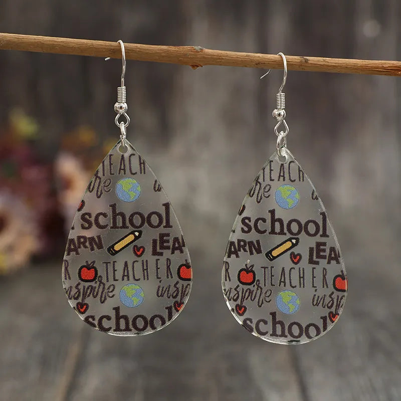 Side angle view of teardrop acrylic earrings with stainless hooks