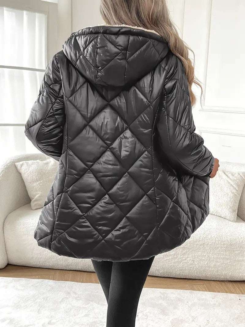 Model wears navy blue women’s winter coat with warm down cotton filling and stylish cut