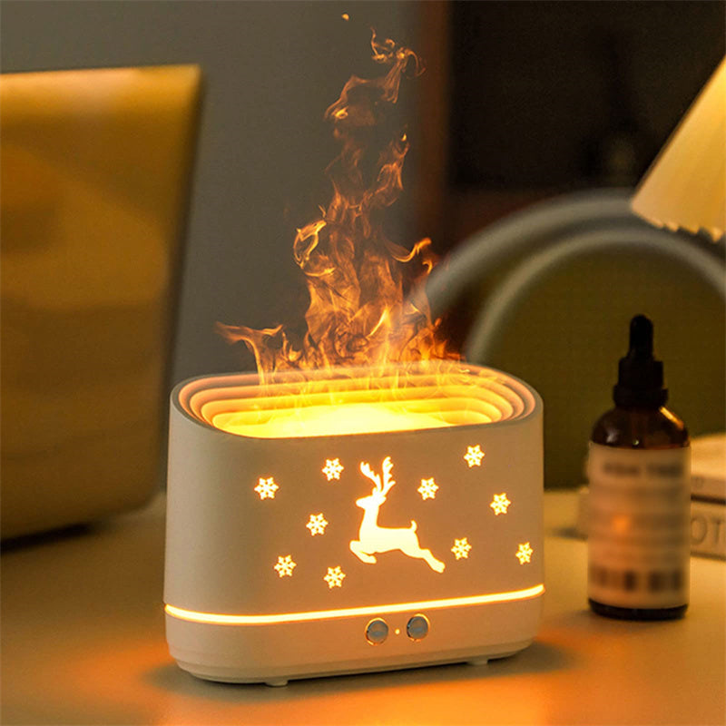 Flame humidifier diffuser aromatherapy setup with winter décor