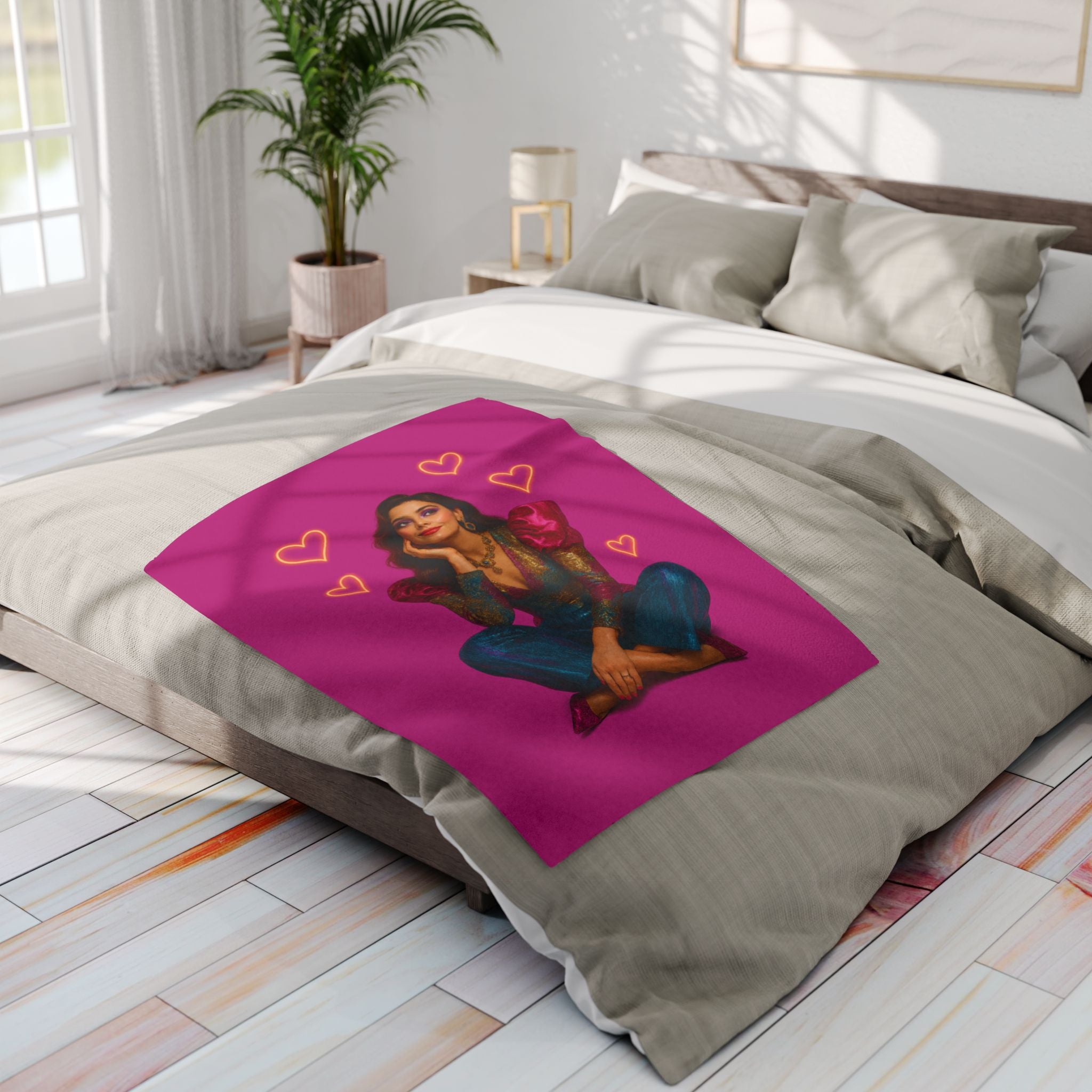 Flat-lay of multicolor Arctic Fleece Blanket with heart motifs