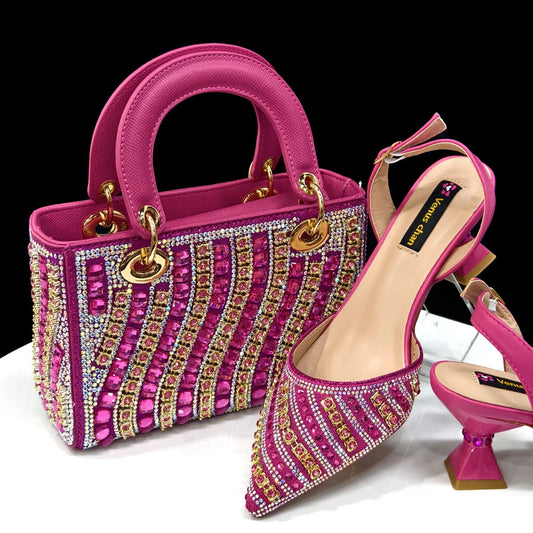 fuchsia high heel shoes and bag set laid flat on white background
