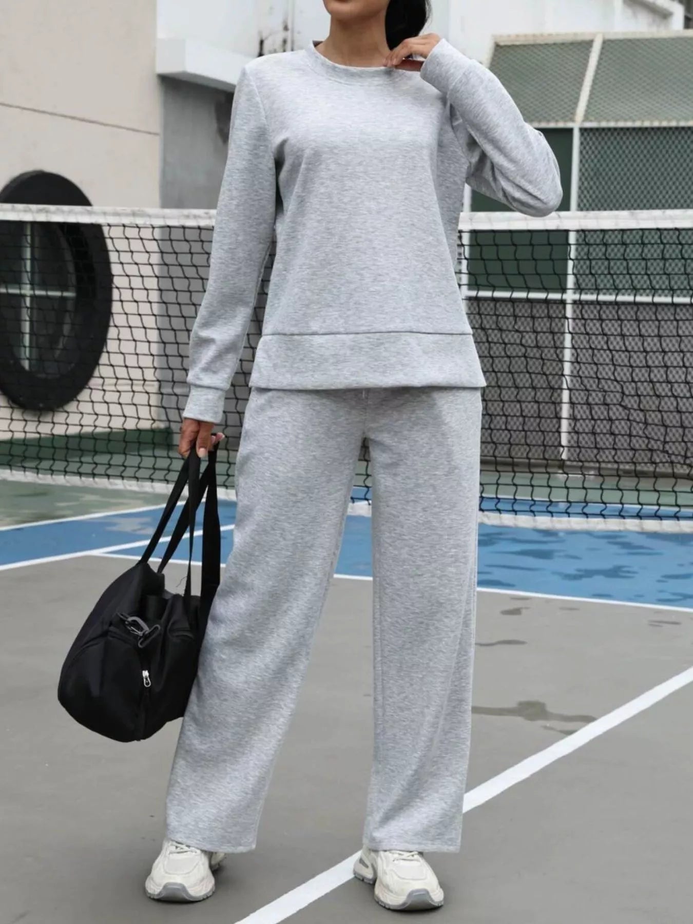 Stylish loungewear ensemble with modern silhouette available in multiple sizes from small to plus