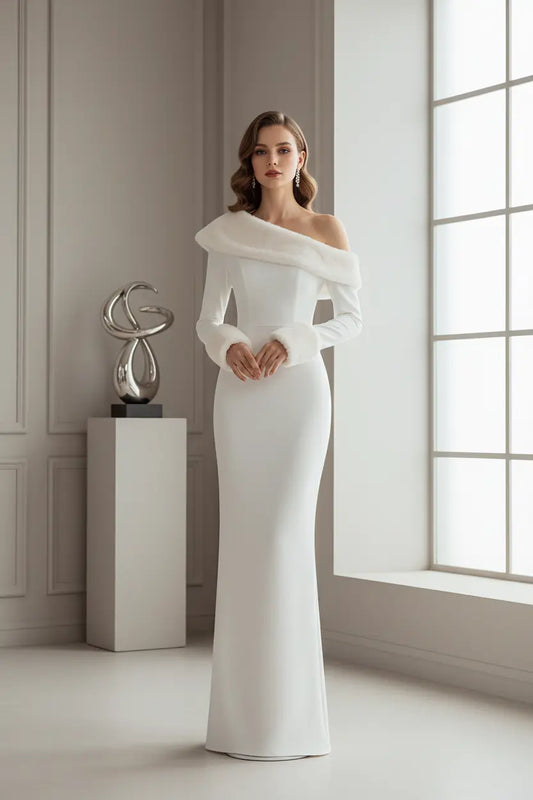 holiday party white dress in solid white, oblique collar detail visible, photographed beside decorated Christmas tree lights