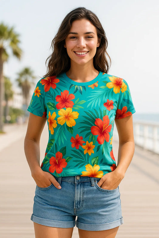 Woman lounging poolside in a breezy botanical-print dress