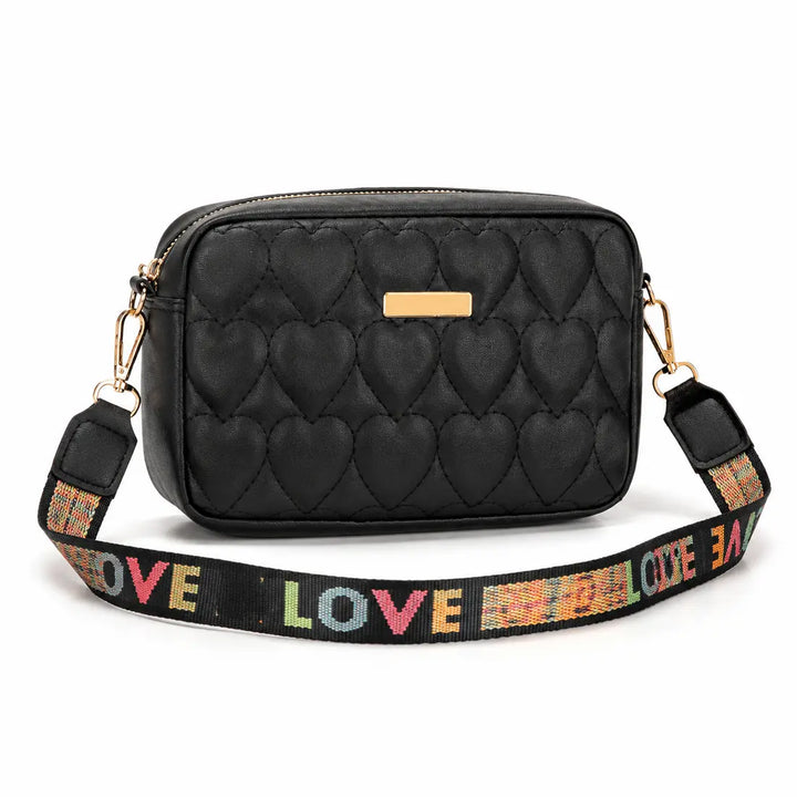 Black heart embroidered shoulder bag with LOVE strap on a white background