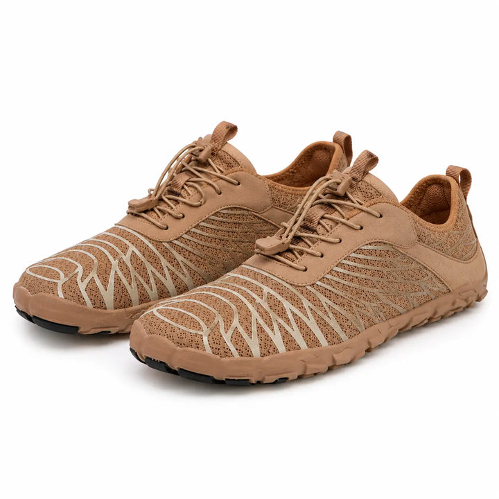 Brown unisex slip-on hiking shoes with mesh uppers and low-cut styling, shown as one pair on a clean white studio background.
