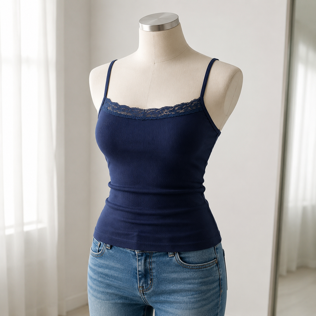 Navy lace-trim ribbed cami displayed on a neutral dress form in a bright boutique setting with the whole shape clearly shown.
