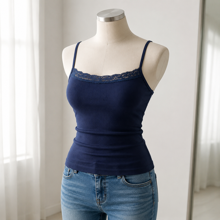 Navy lace-trim ribbed cami displayed on a neutral dress form in a bright boutique setting with the whole shape clearly shown.