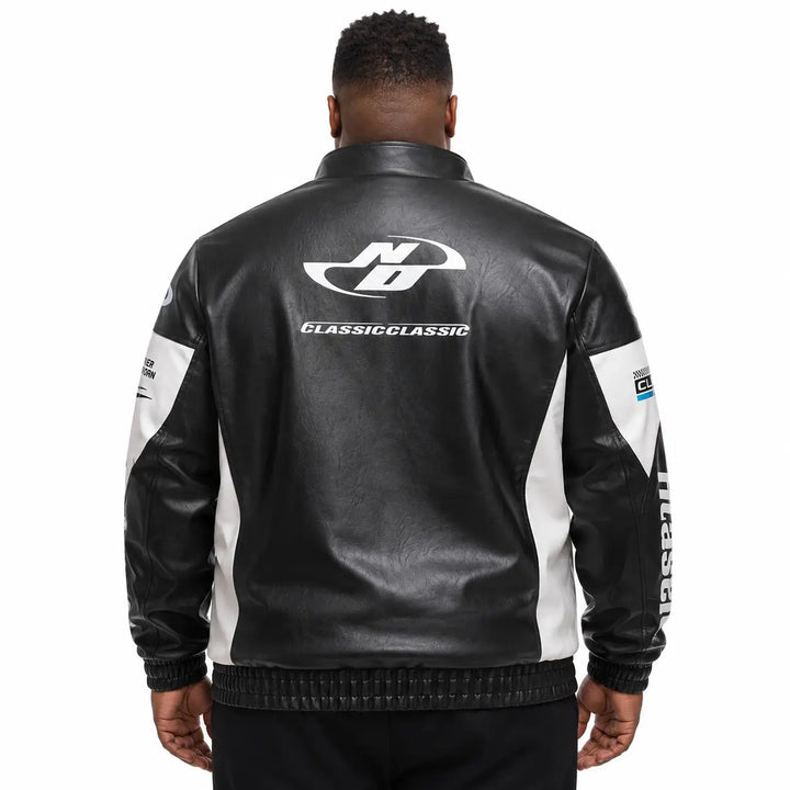 Black colorblock zip-up jacket back view showing contrast white panel layout, printed back detail, elasticated cuffs and hem.