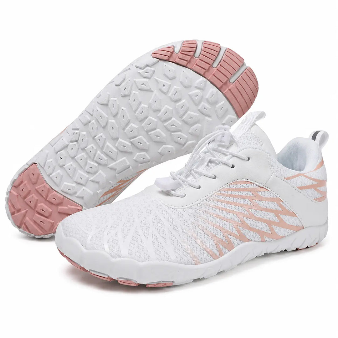 White and pink unisex slip-on hiking shoes with mesh uppers and segmented soles, shown as a pair on a clean white background.