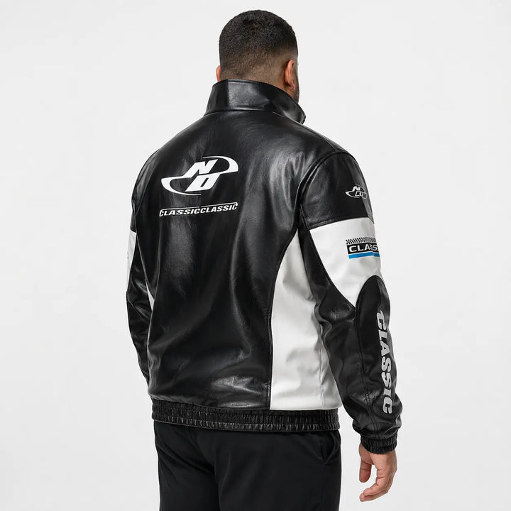 Black colorblock zip-up jacket side view, showing high stand collar, full front zipper, contrast white panels, cuffs and hem.