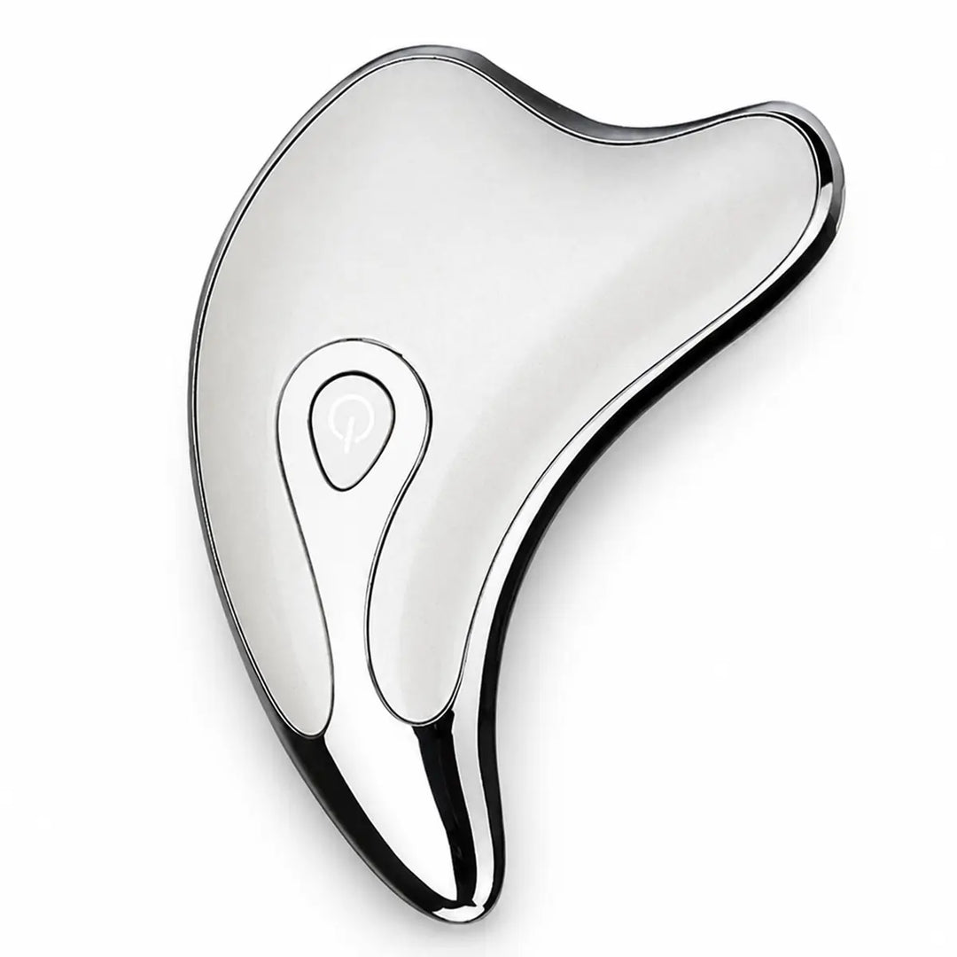 Silver facial massage tool on a white studio background, showing its curved edges, reflective finish and a main power button.