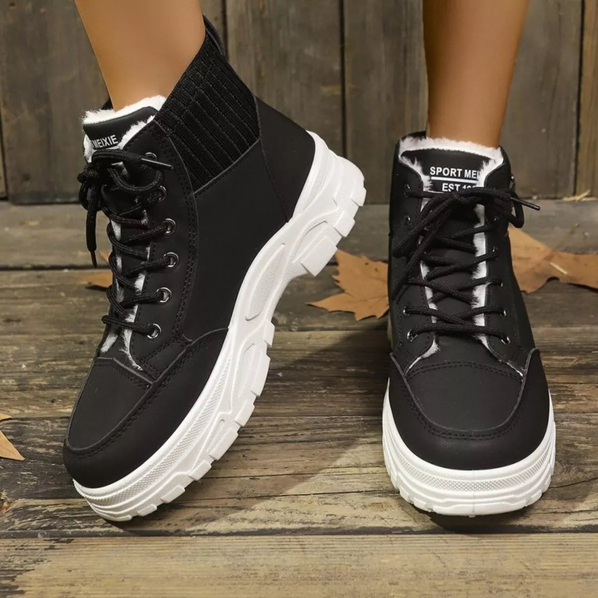 Close-up of thick 11mm plush faux fur lining inside warm winter lace up boots for women