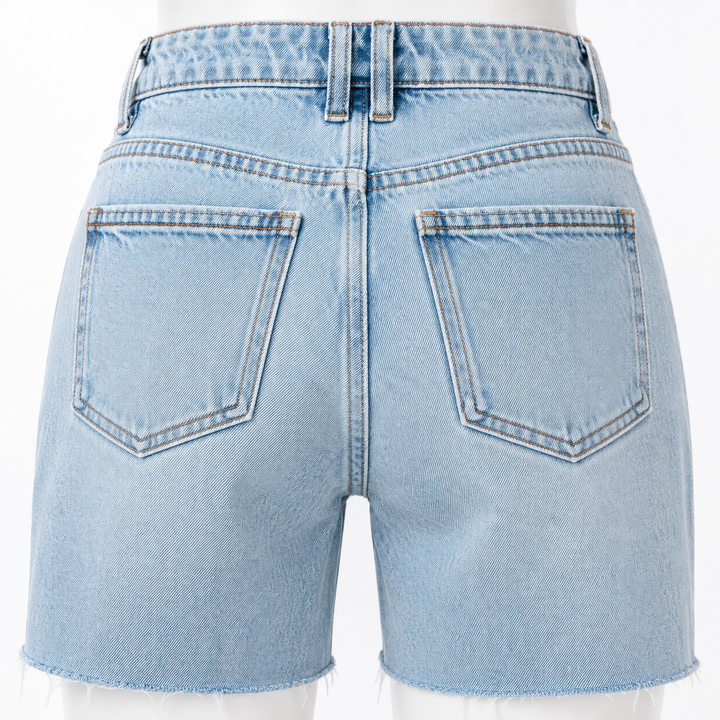 Close-up of back pockets, belt loops and contrast stitching on blue denim shorts