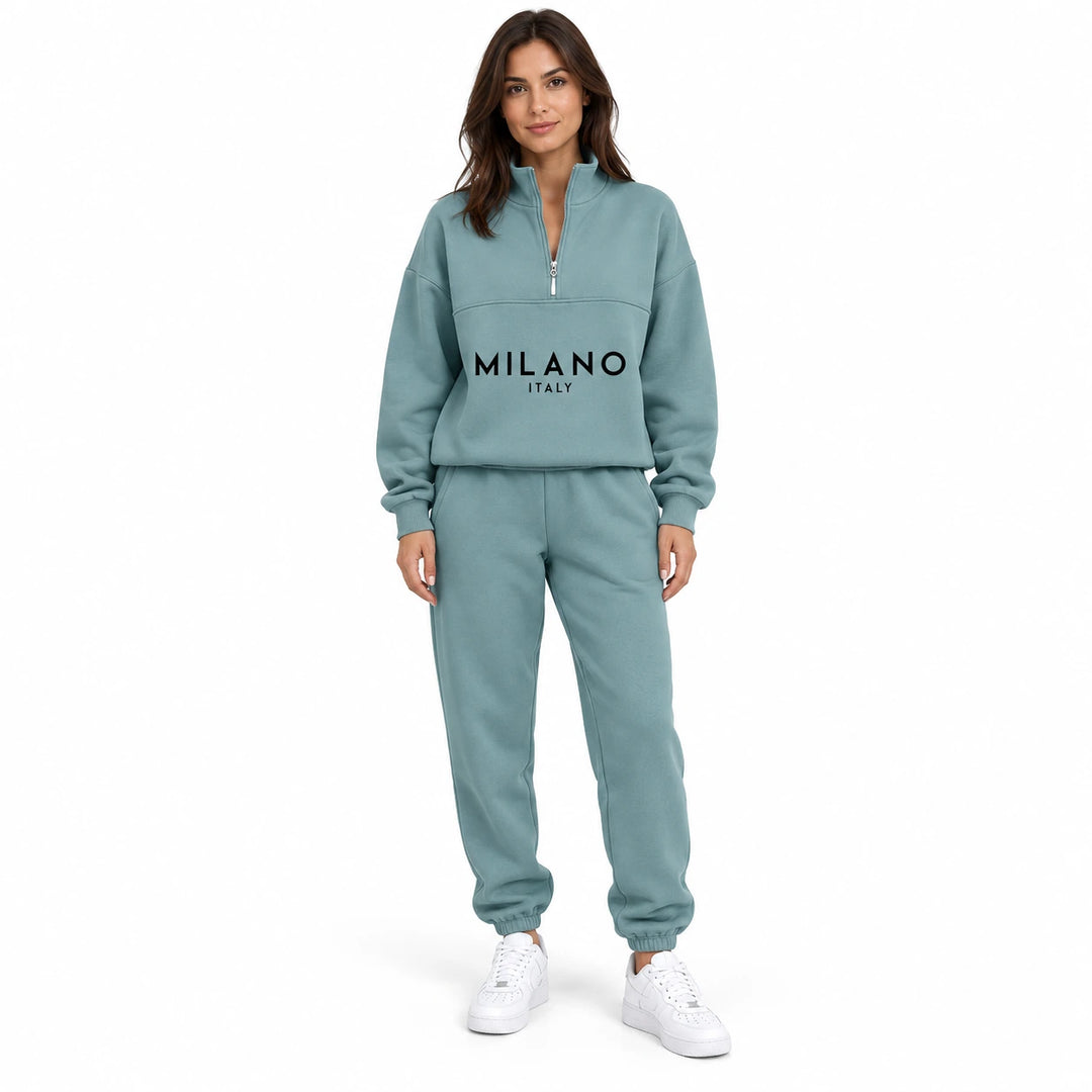 Woman wearing the muted teal Blue half zip sweatshirt and matching jogger set