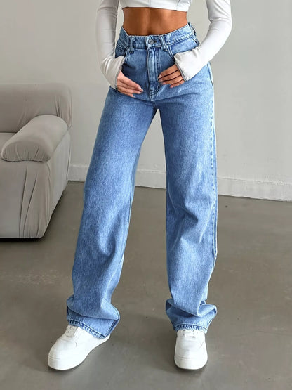 womens baggy jeans wide-leg silhouette side view in blue denim for relaxed, polished day-to-night wear
