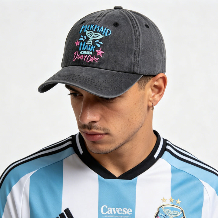 Person wearing a gray cap with a colorful design and a sports jersey with &