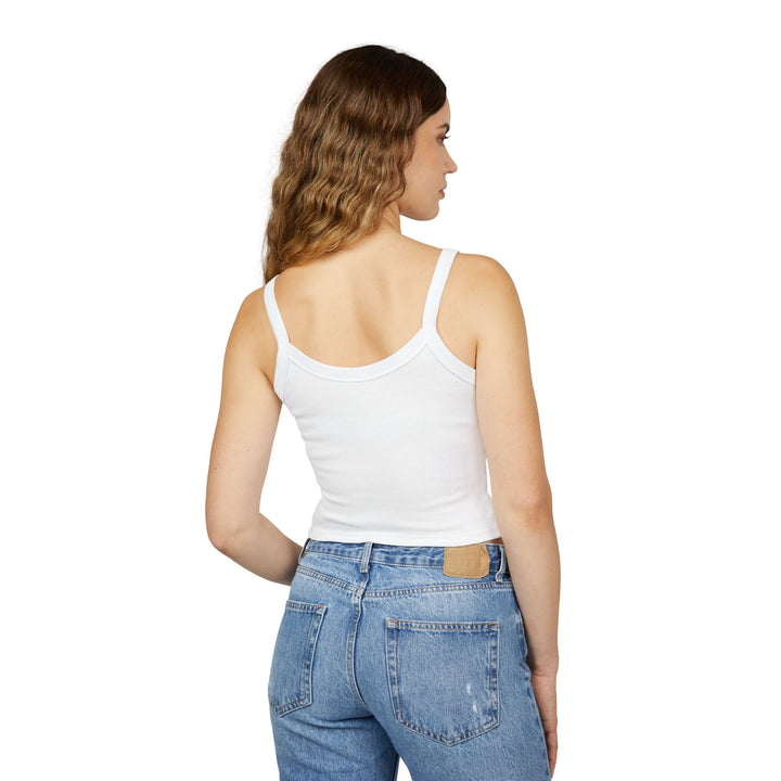 Woman wearing a white tank top and blue jeans on a white background