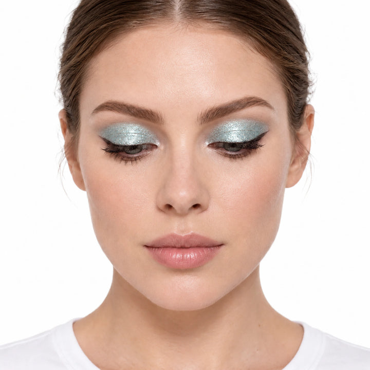 PHOERA Azul Lemonade liquid eyeshadow shown as pale aqua shimmer on a model against white