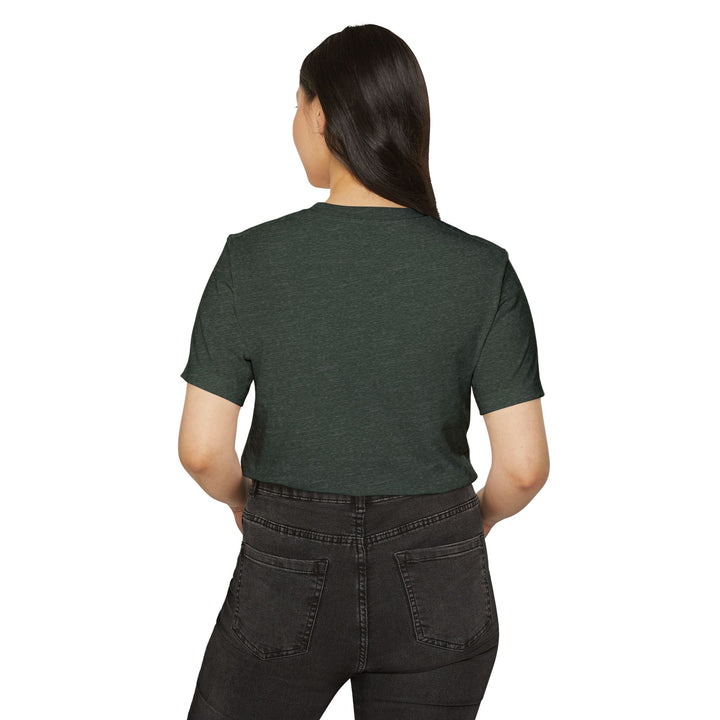Person wearing a green t-shirt and black pants on a white background