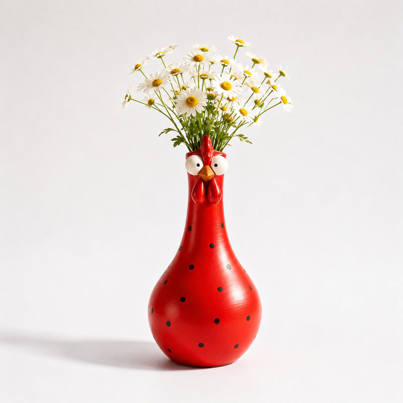 Colorful rooster sculpture with long neck, polka-dot details and resin construction shown as tabletop decorative home accent.