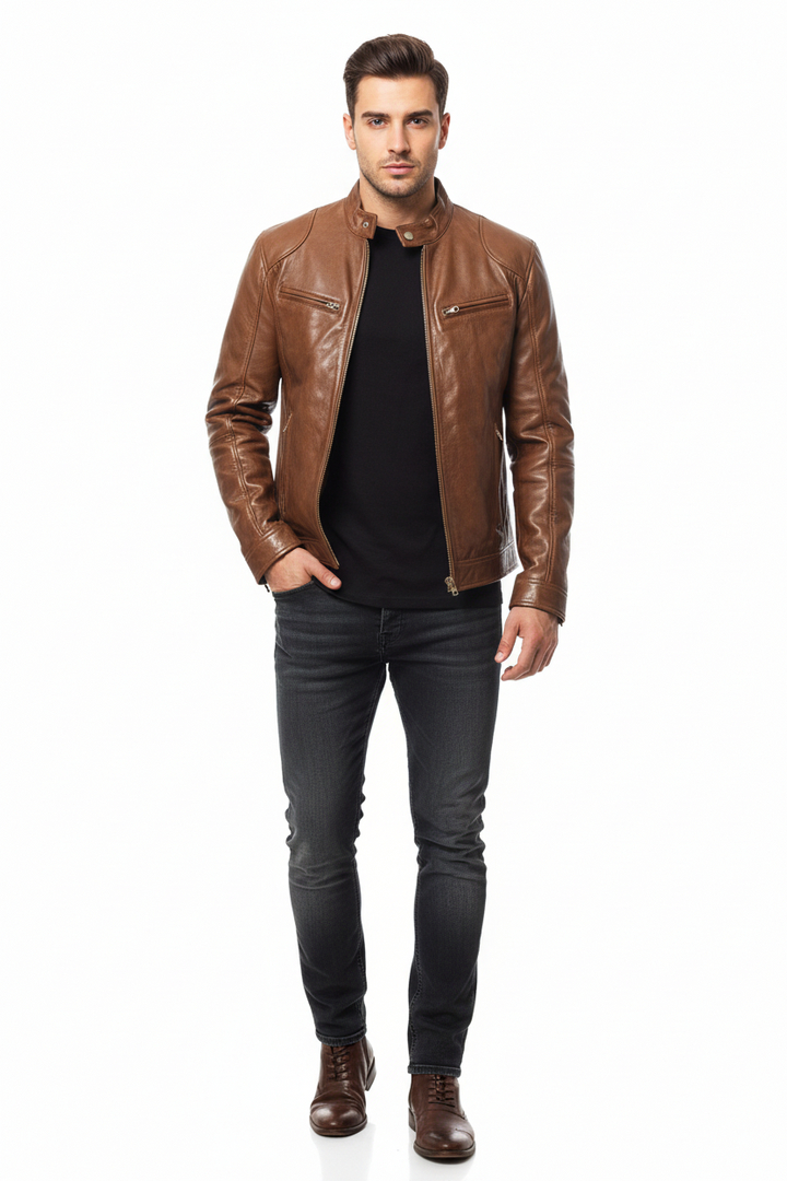 Man wearing a brown leather jacket and dark jeans on a white background
