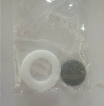 Packaged set of white and black rubber washers on a plain background