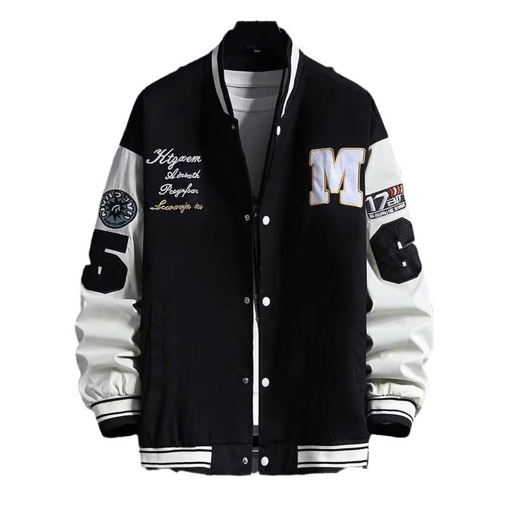 men's baseball jacket black colorway styled with sneakers city environment