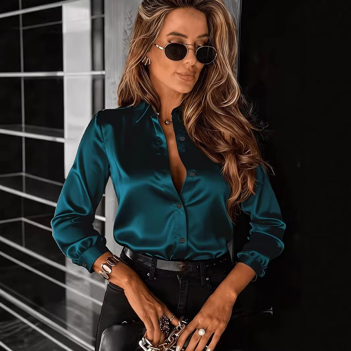 Drapey satin blouse styled with slim belt and structured pants