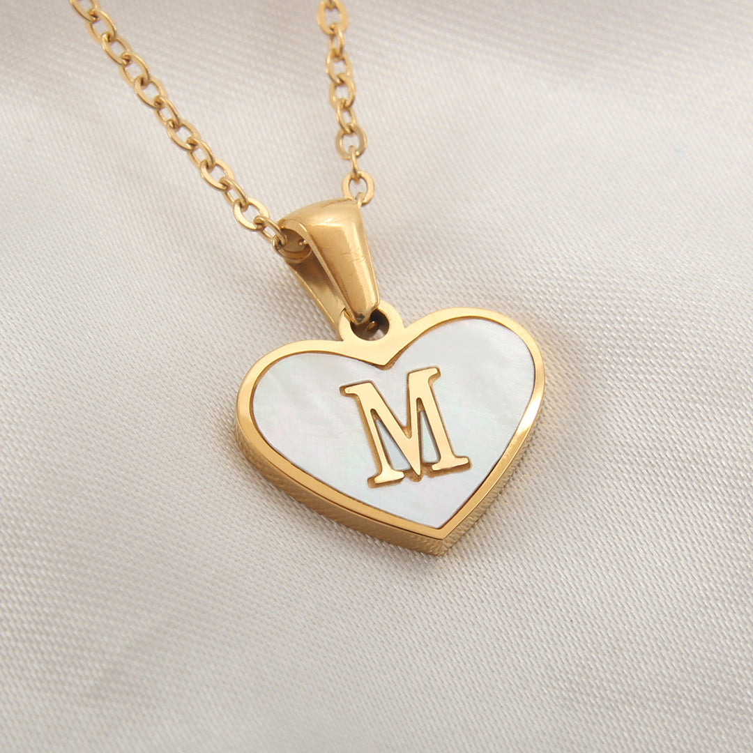 Personalized alphabet necklace with heart-shaped initial pendant, stainless steel and gold-plated finish - Product reference.