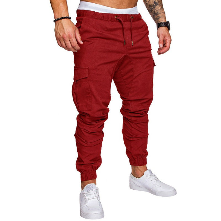Multi-pocket workwear trousers for men in cotton blend with loose fitting shape mid waist and lace-up closure for casual wear