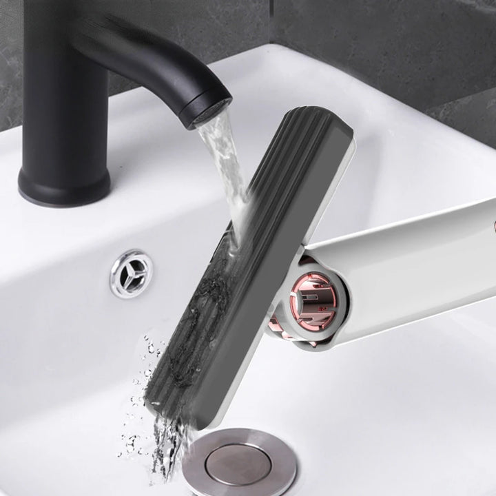 Black faucet with water flowing into a sink