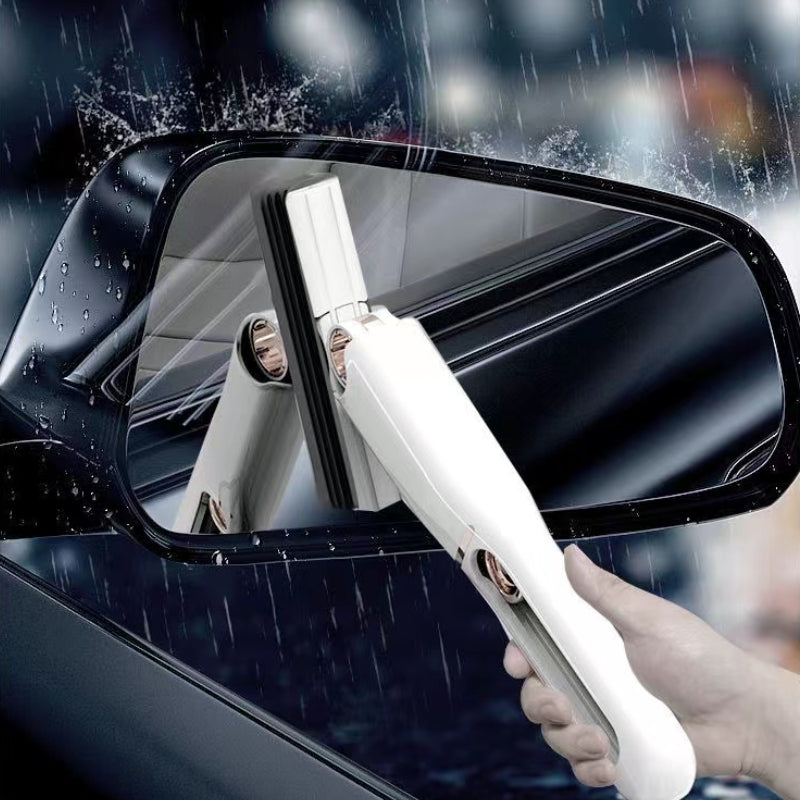 Person cleaning a car mirror with a white cleaning tool in rainy conditions.