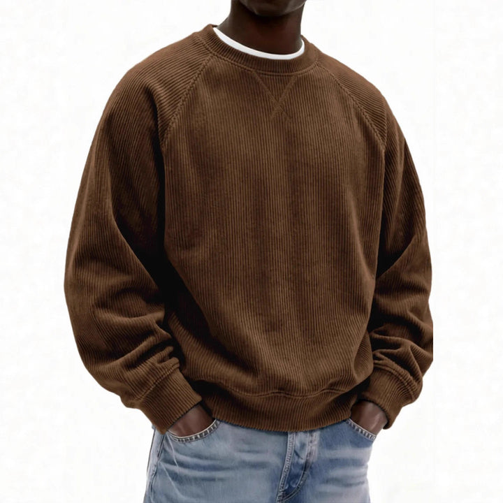 Brown corduroy sweatshirt worn by a person on a white background