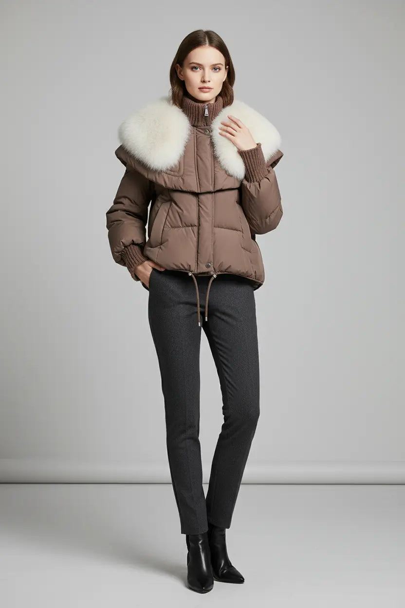 short parka coat with faux fur collar shown in white, thick quilted body, high neckline and structured shoulder cape
