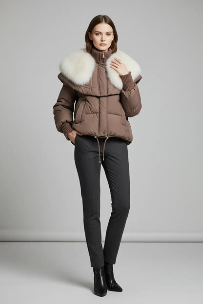 short parka coat with faux fur collar shown in white, thick quilted body, high neckline and structured shoulder cape
