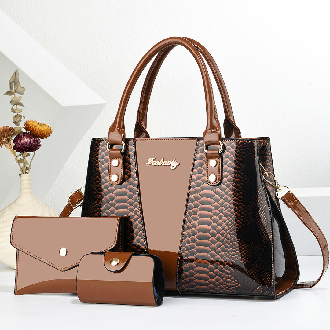 Brown handbag with textured pattern and matching wallet on a white background