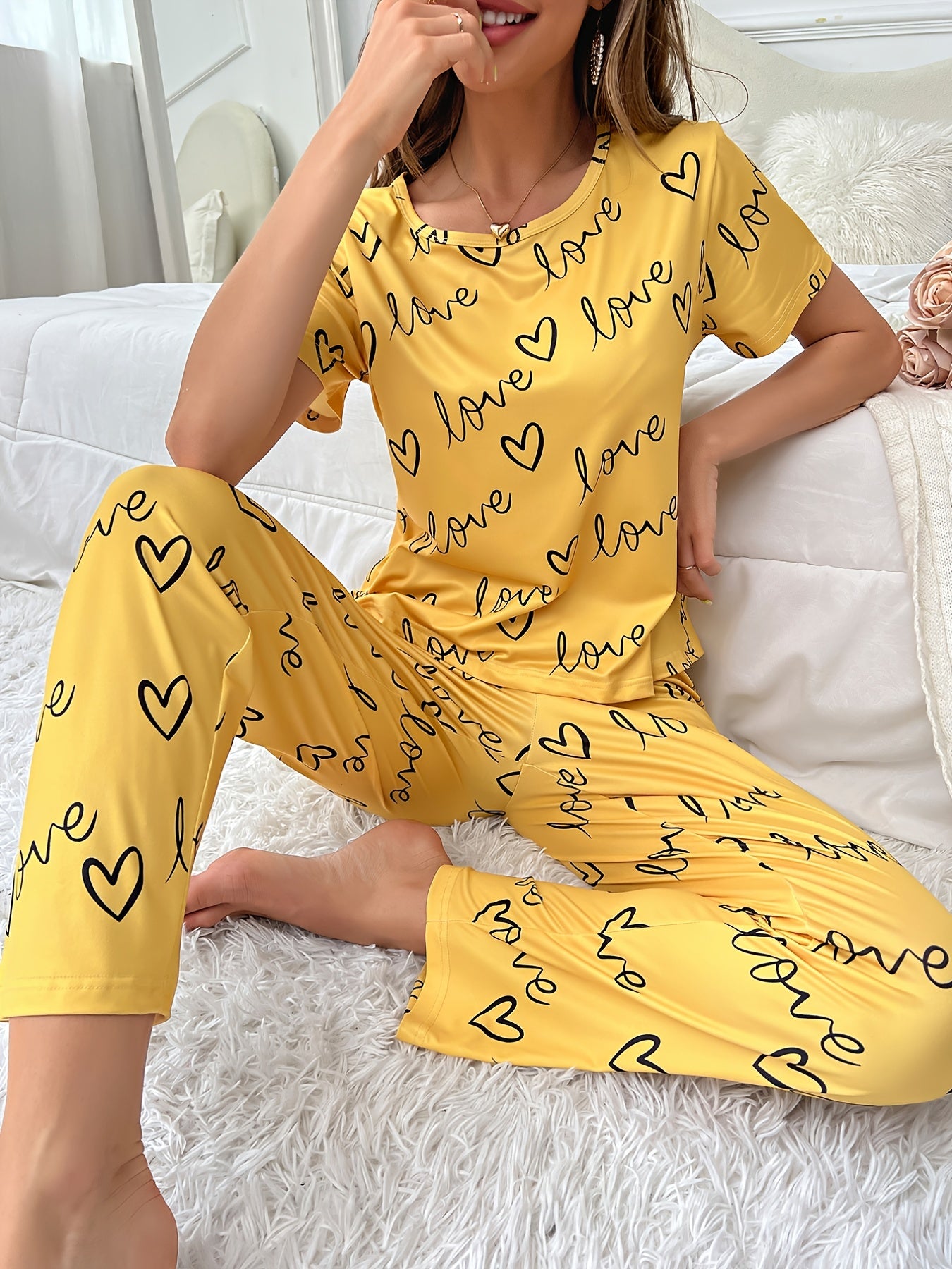 alphabet print pajama set for women cozy knit lounge outfit styled with slippers and warm blanket