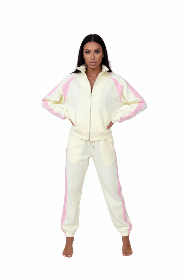 Side profile of orange polyester tracksuit set on a model, regular sleeve length, slim trouser cut

