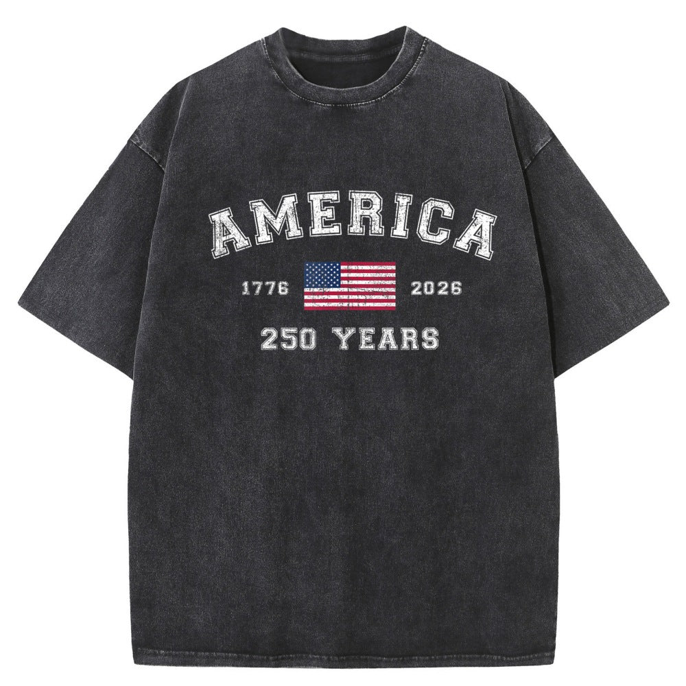 A faded black short-sleeve t-shirt with a distressed graphic on the front reading &