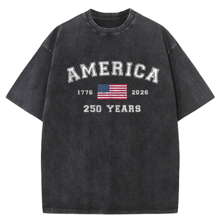 A faded black short-sleeve t-shirt with a distressed graphic on the front reading &