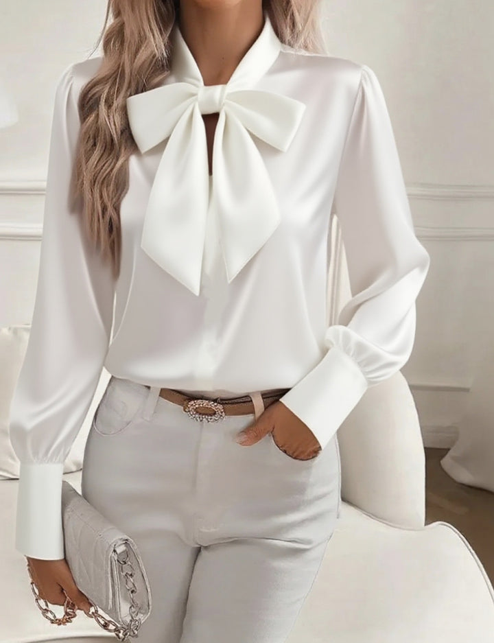Elegant long sleeve top shown with clean tailored styling