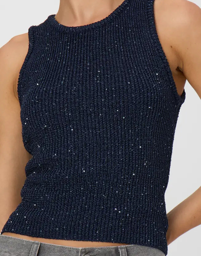 Navy blue ribbed tank top with glittery accents on a neutral background