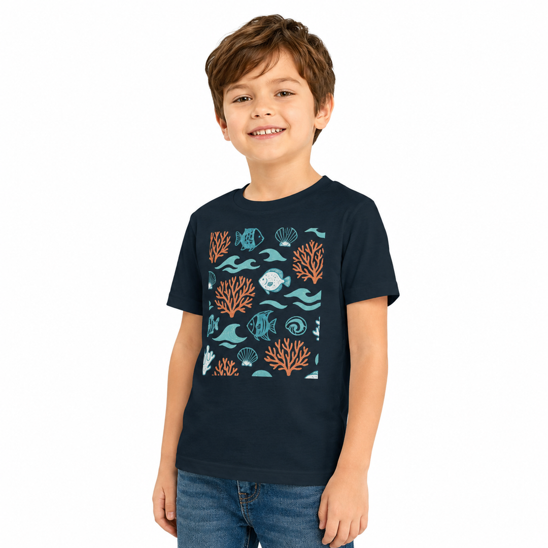 Child wearing a navy blue t-shirt with ocean-themed graphics on a white background