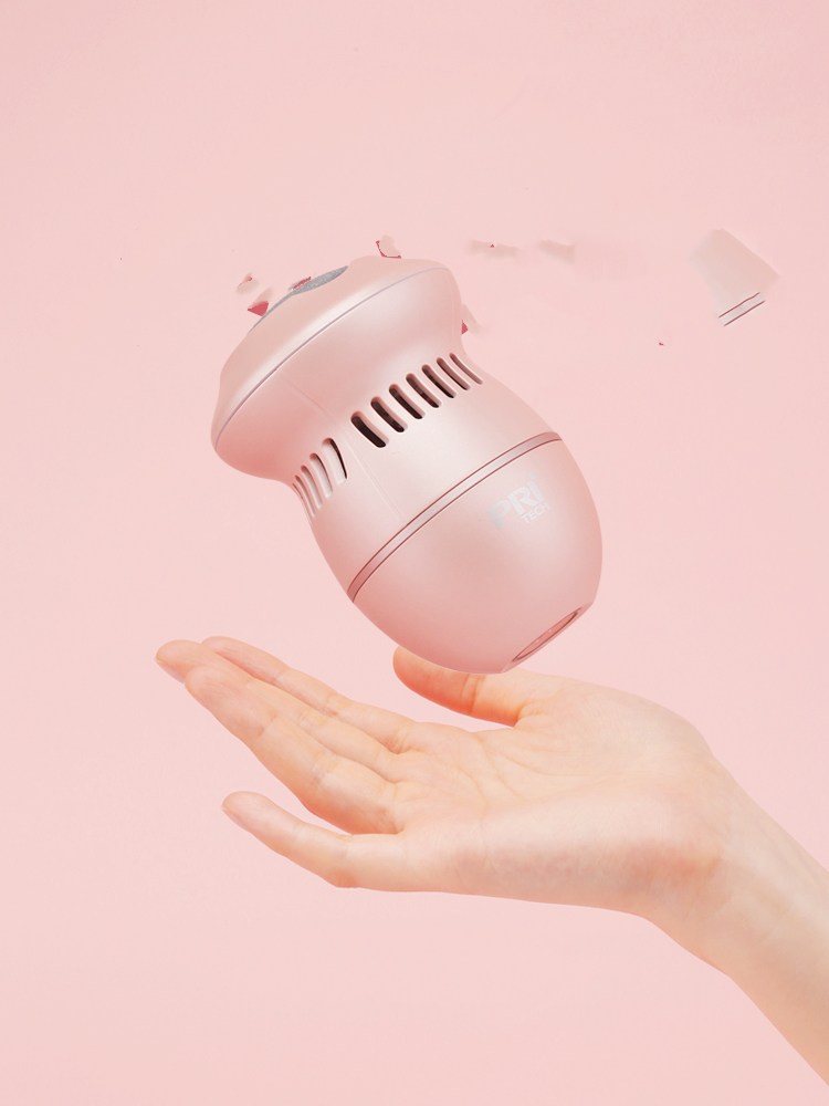 Electric pedicure foot file removing rough heel skin in a bright bathroom setting