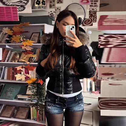 Detachable sleeve hooded coat pocket detail with cinched waist silhouette, waist cinching winter jacket look
