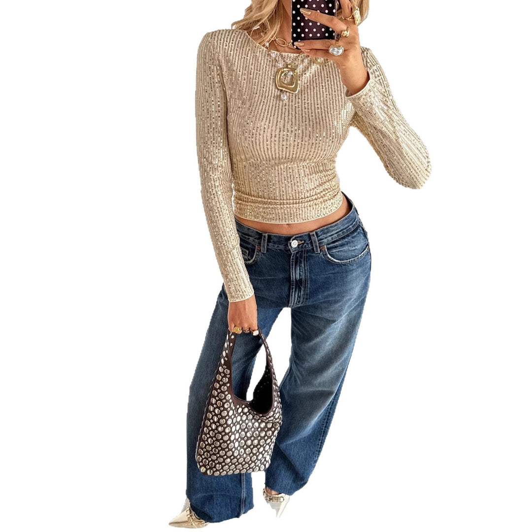 slim fit party top champagne under warm lighting